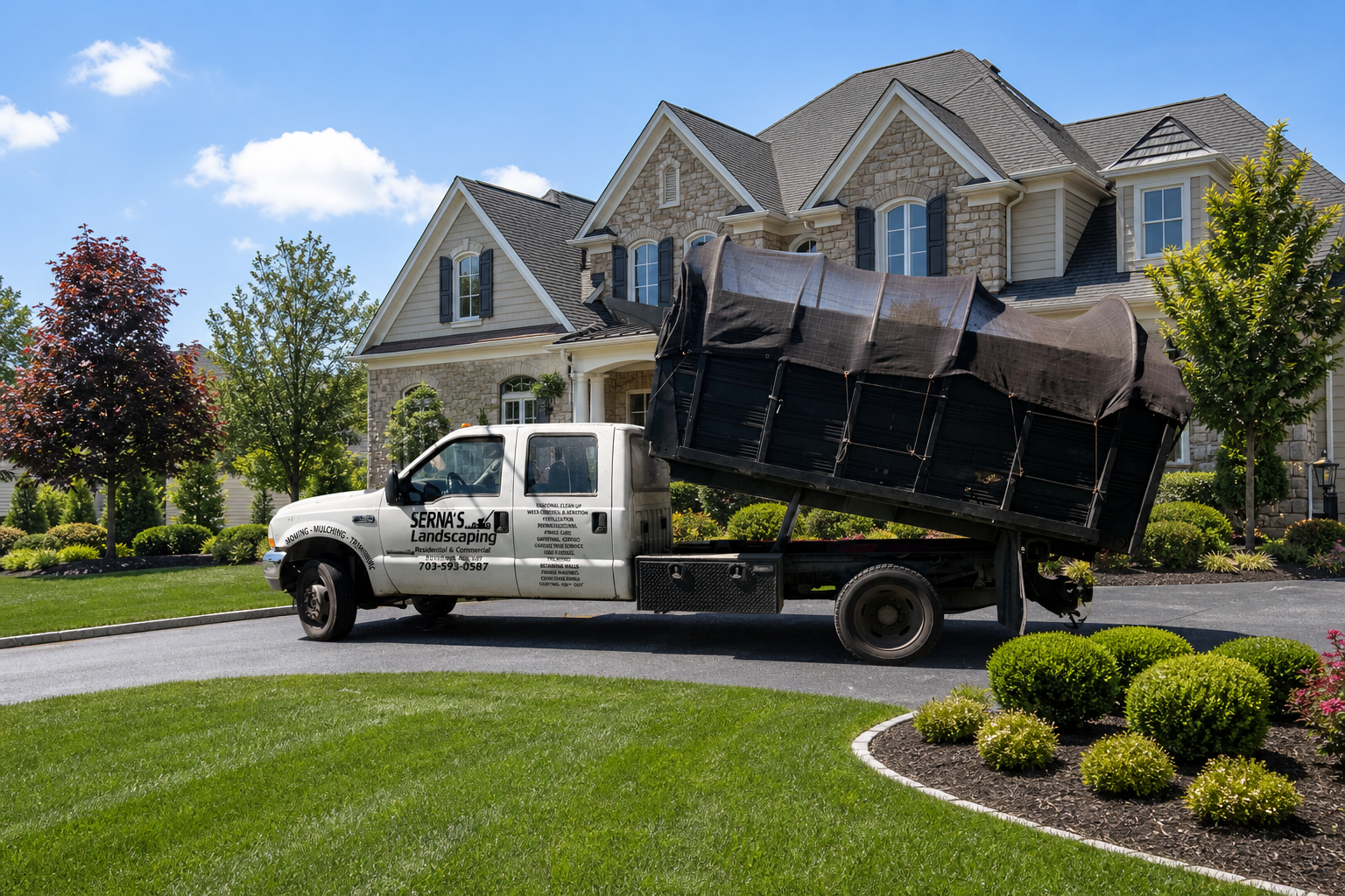 Serna's Landscaping truck in front of a large home with a manicured lawn